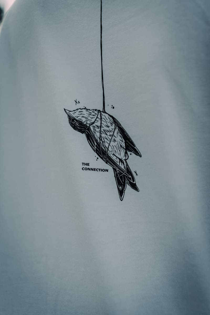 White oversized t-shirt with CONNECTION OVERSIZED TEE UNISEX print - Wolfpack Clothing